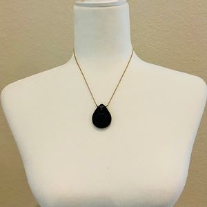 Onyx pendant on gold colored chain